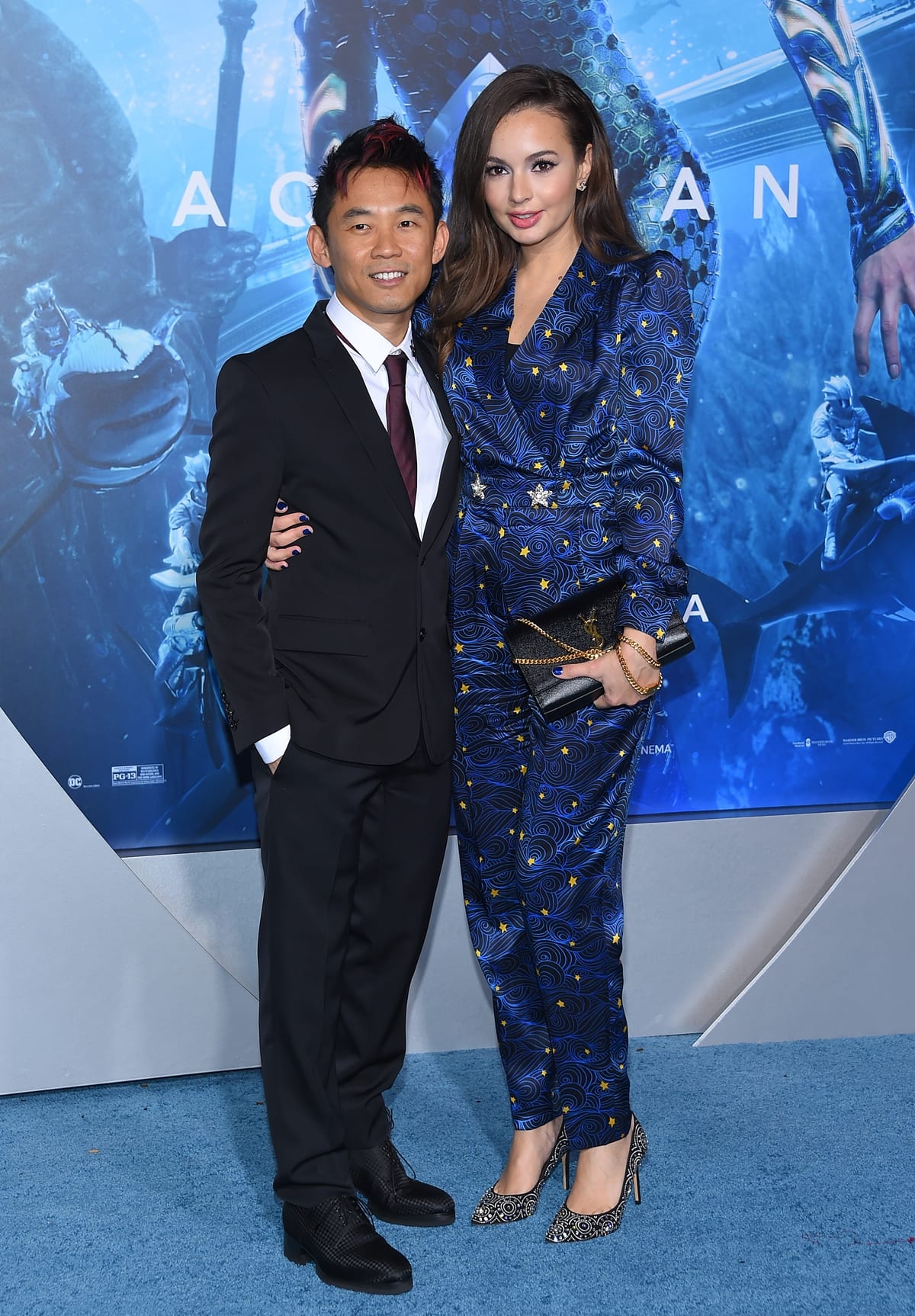 Director James Wan and his much taller wife Ingrid Bisu arrive for the Premiere Of Warner Bros. Pictures' "Aquaman"