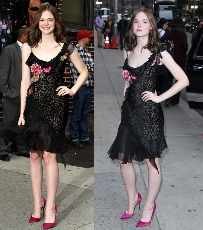 Elle Fanning strikes a balance between bold and feminine in a black floral-embellished dress, paired with vibrant pink heels for a playful yet elegant look on the streets of New York