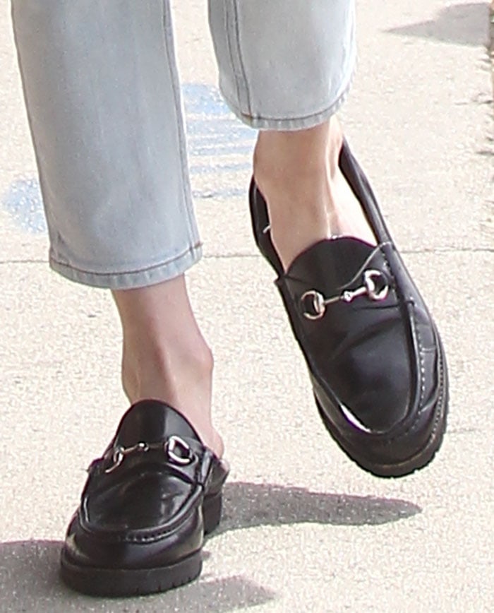 Emma Roberts's feet in horsebit-detailed Gucci loafers