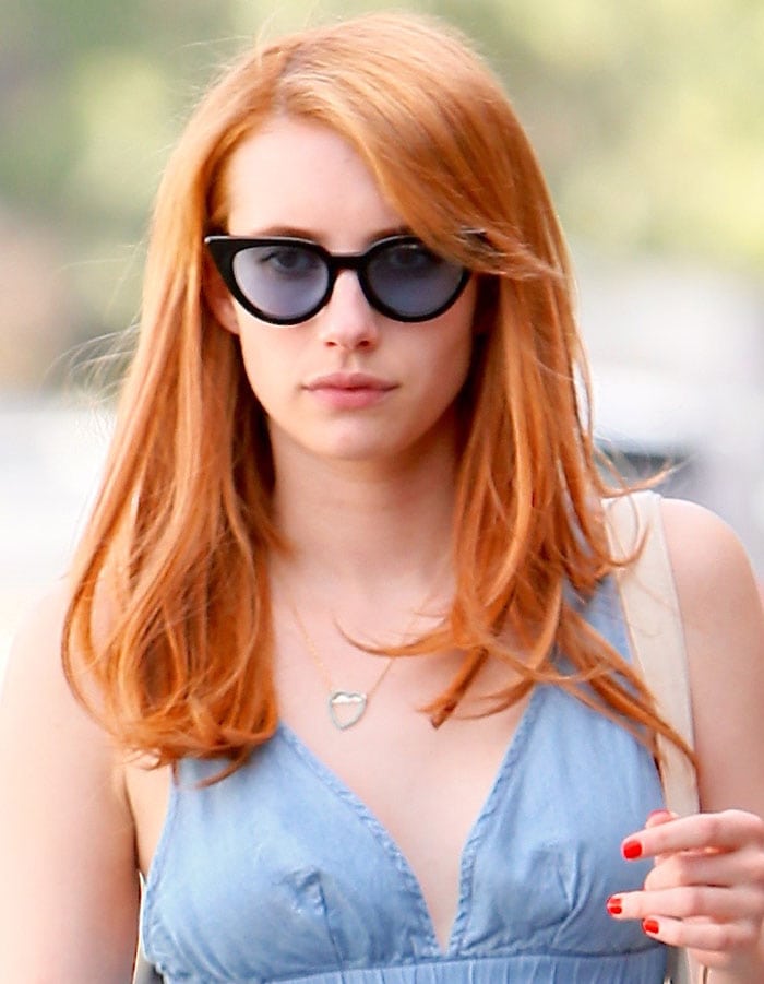 Emma Roberts sports bright red hair as she leaves 901 Salon