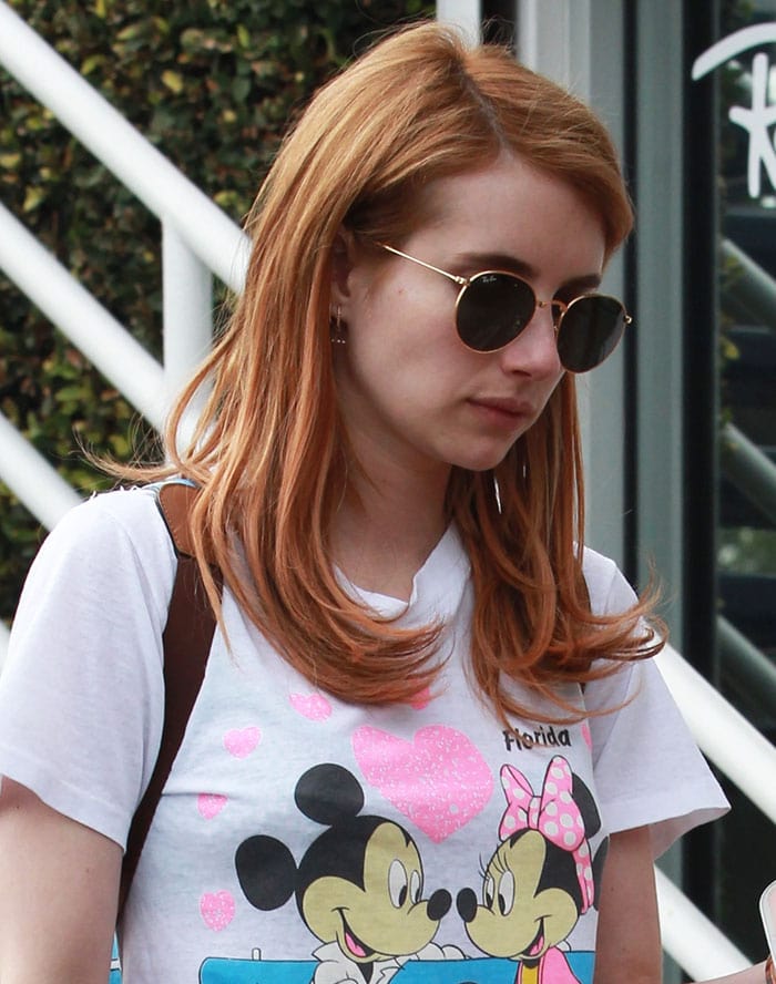 Emma Roberts wears her red hair down in a Mickey and Minnie Mouse T-shirt