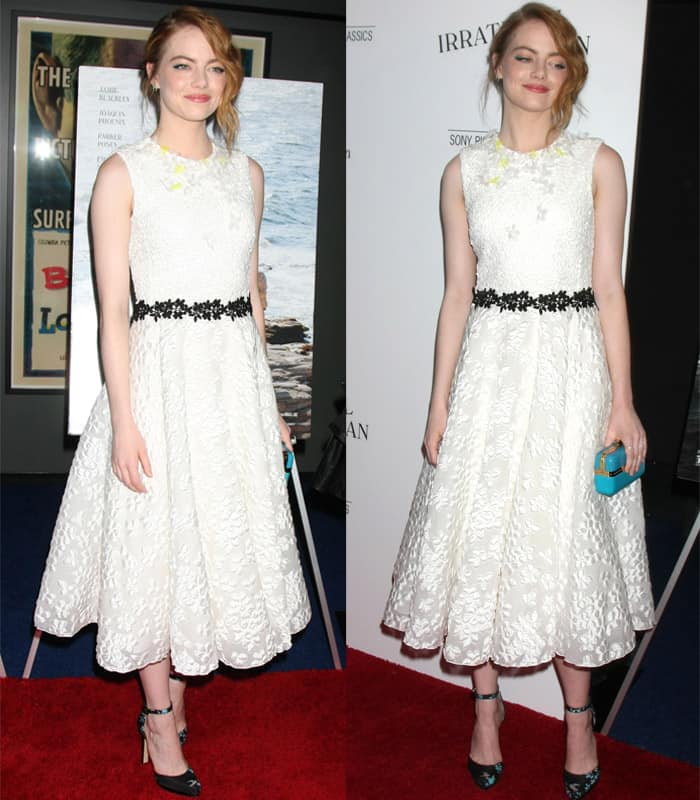 Emma Stone embodies timeless elegance in a white floral-embossed dress with a delicate black waistband, adding a pop of color with her turquoise clutch at the 'Irrational Man' premiere