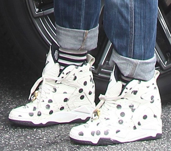 Gwen Stefani wears a pair of polka dotted Melody Ehsani x Reebok sneakers