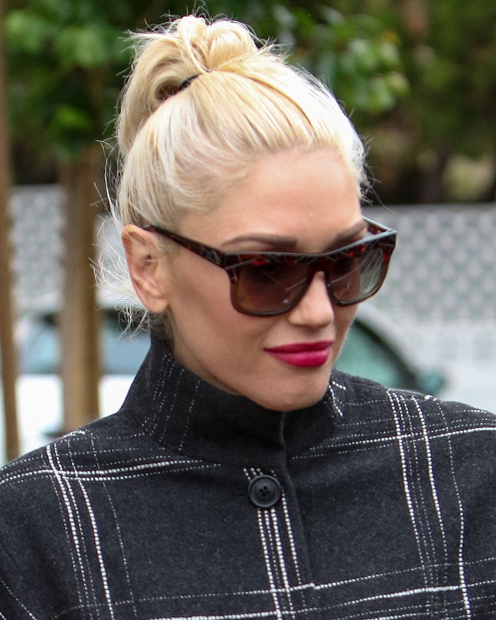 Gwen Stefani wears her bleached hair up as she visits Bristol Farms grocery store with her sons