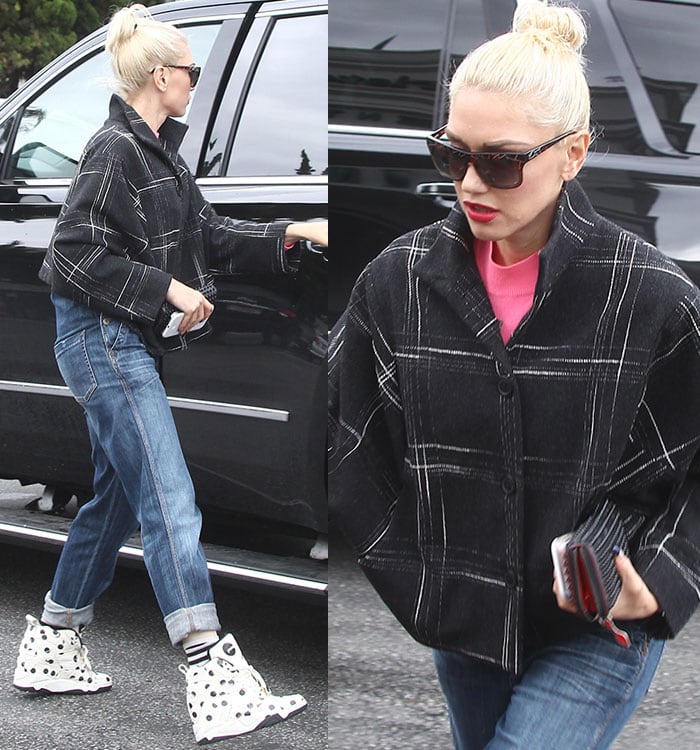 Gwen Stefani cuffs her jeans while out shopping in Los Angeles