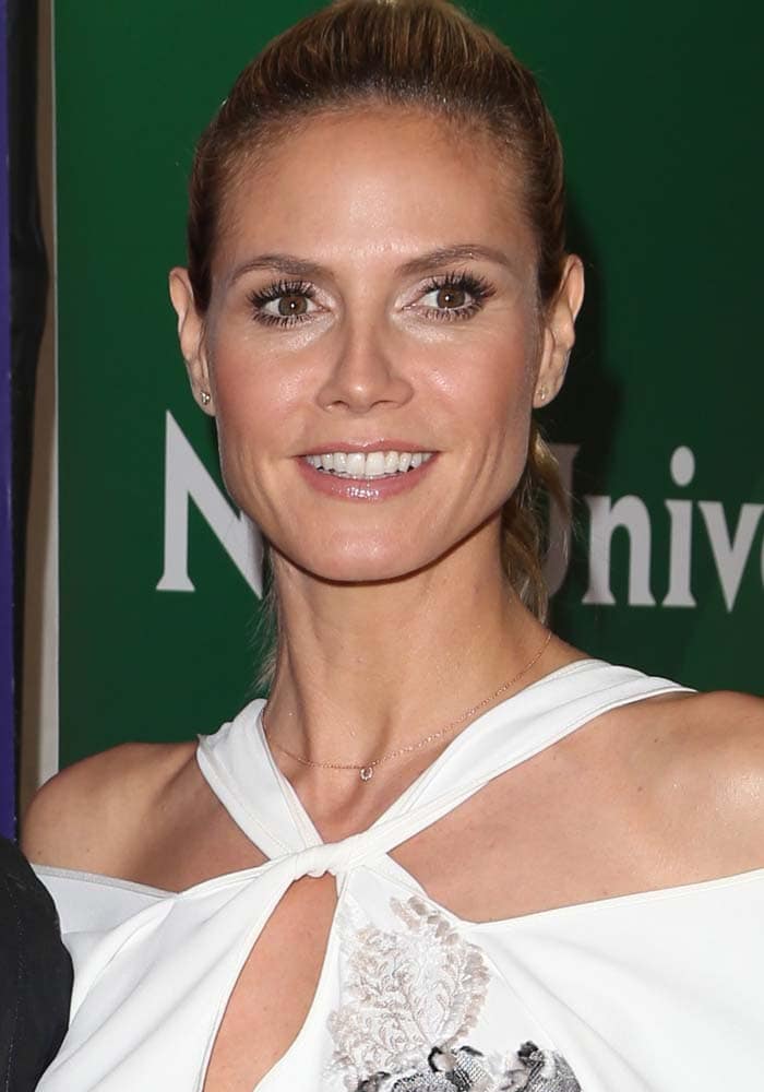 Heidi Klum styles her hair into a ponytail for the 2016 NBC Universal Summer Press Day