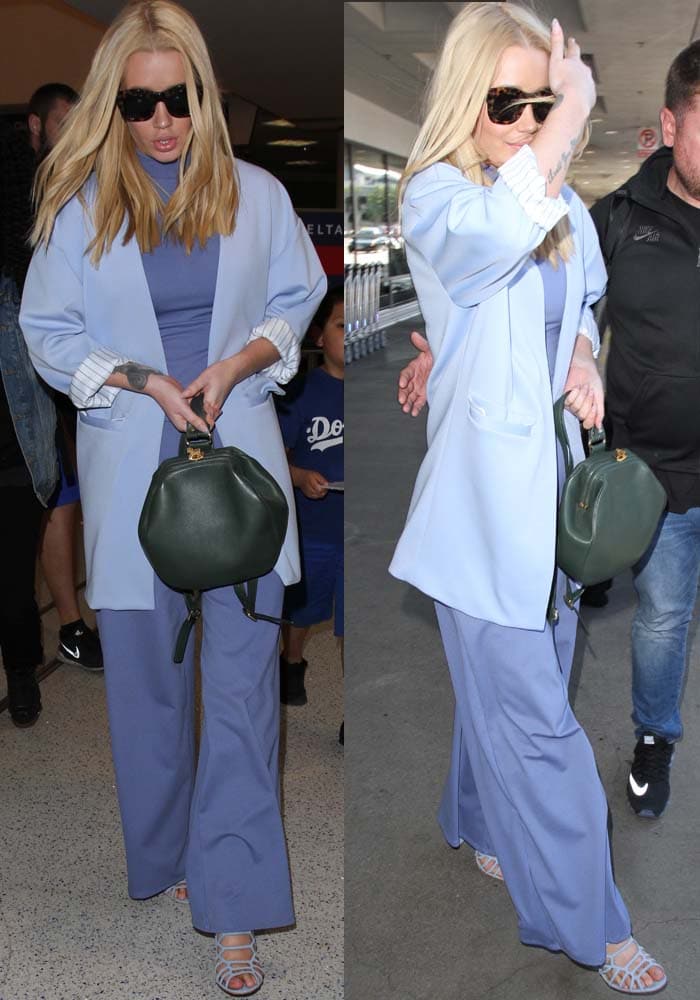 Iggy Azalea in a jumpsuit with a high neck and wide leg pants