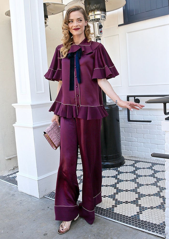 Jaime King glams up a pajama-like satin set from Roksanda Ilincic with styled hair and full makeup