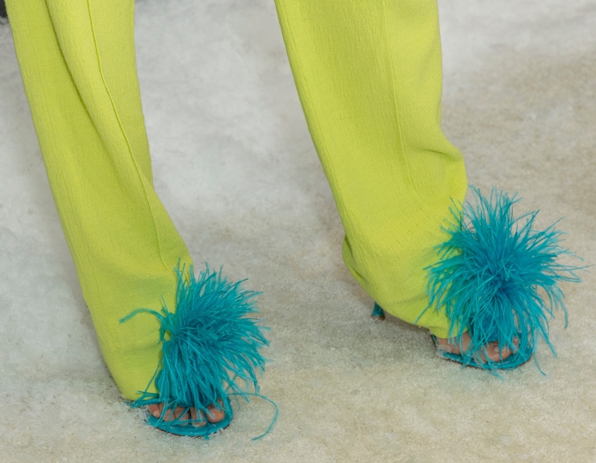 Jamie Chung wears turquoise Bottega Veneta Dot feather-trimmed leather sandals