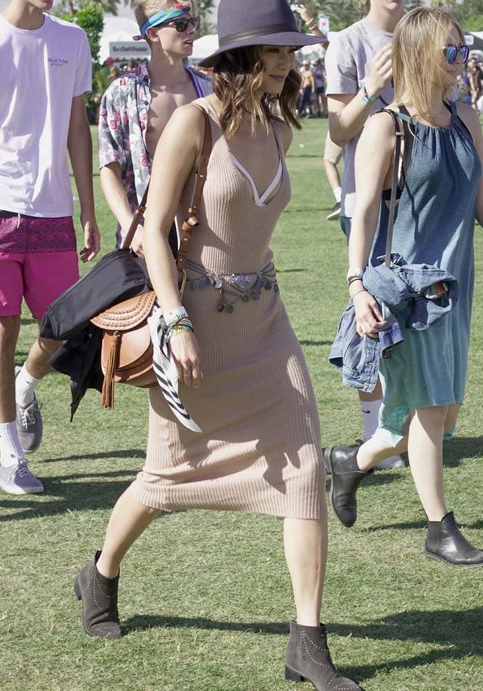 Jamie Chung covers her Tezenis nipple pasties with a ribbed knit dress at Coachella