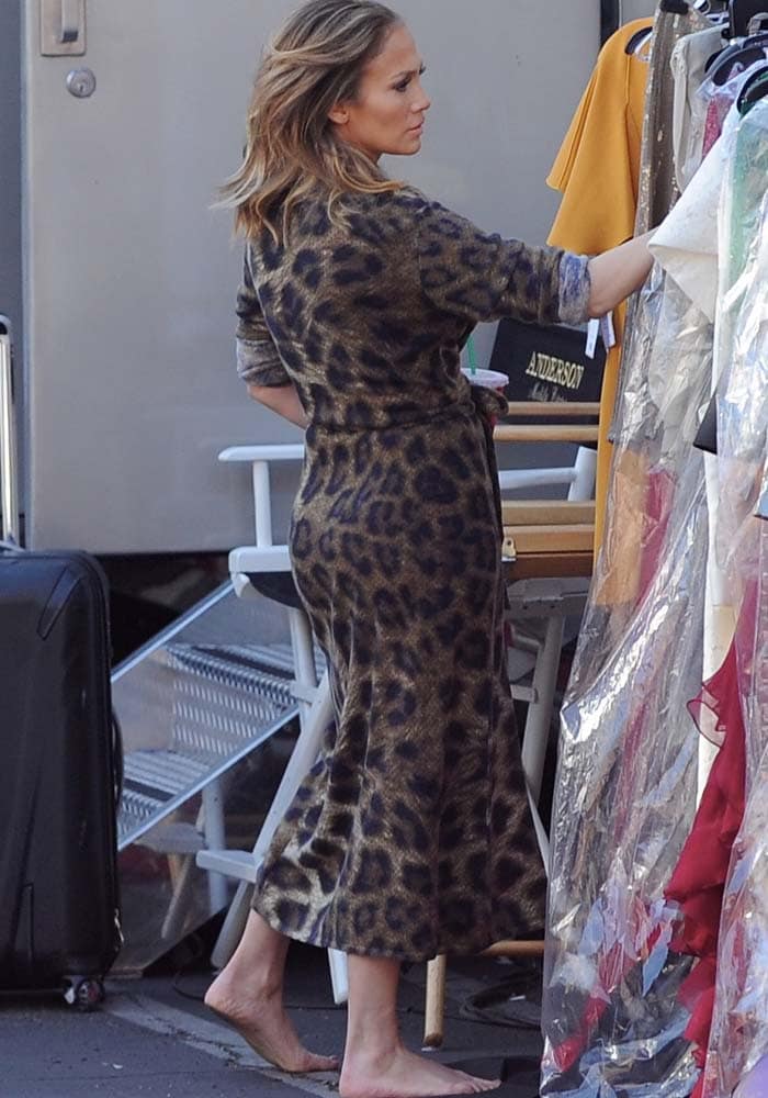 Cinderella moment: J.Lo was spotted going through racks of clothes without shoes on