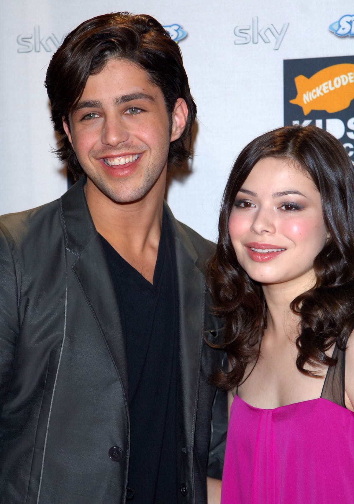 Miranda Cosgrove posing with Josh Peck, who played her stepbrother Josh Nichols in Drake & Josh