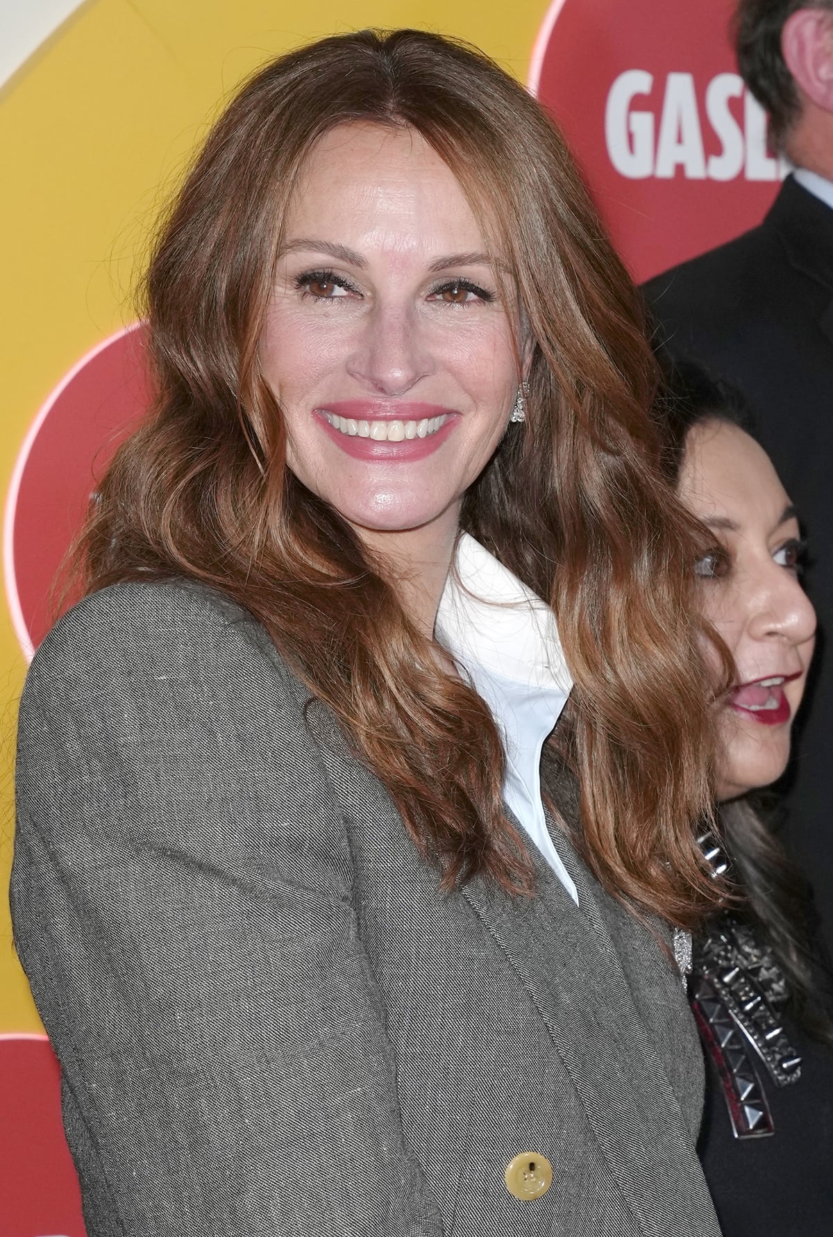 Julia Roberts flashes her signature smile at the premiere of her American political thriller limited television series Gaslit