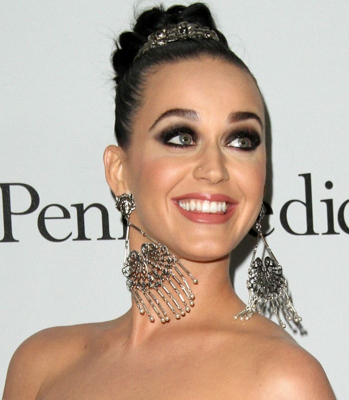 Katy Perry exudes glamour with dramatic smokey eyes and oversized chandelier earrings