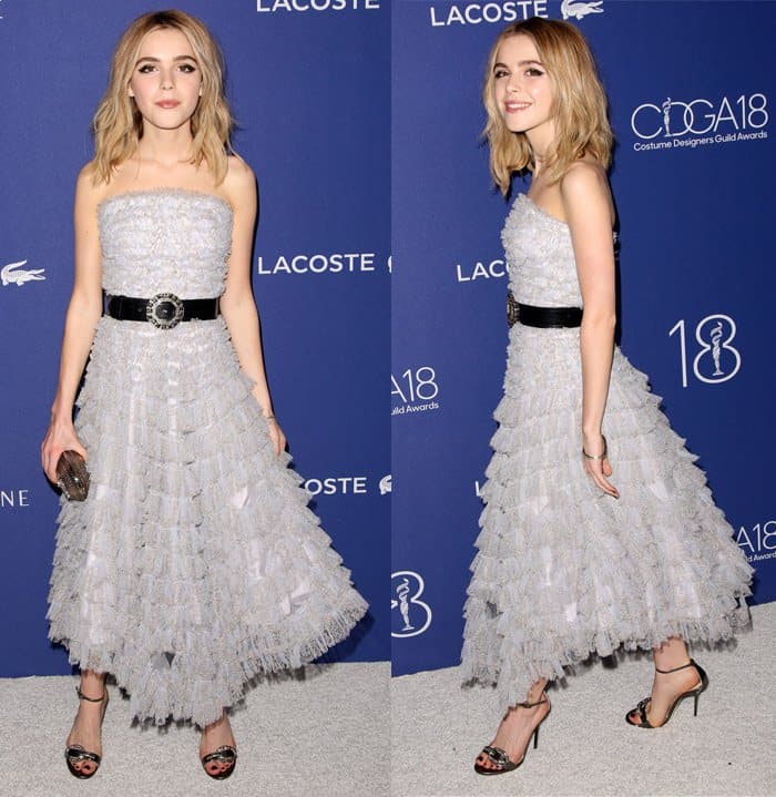 Kiernan Shipka captivates with her feminine allure in a strapless ruffled dress, accentuated by a bold belt and elegant heels, at the Costume Designers Guild Awards