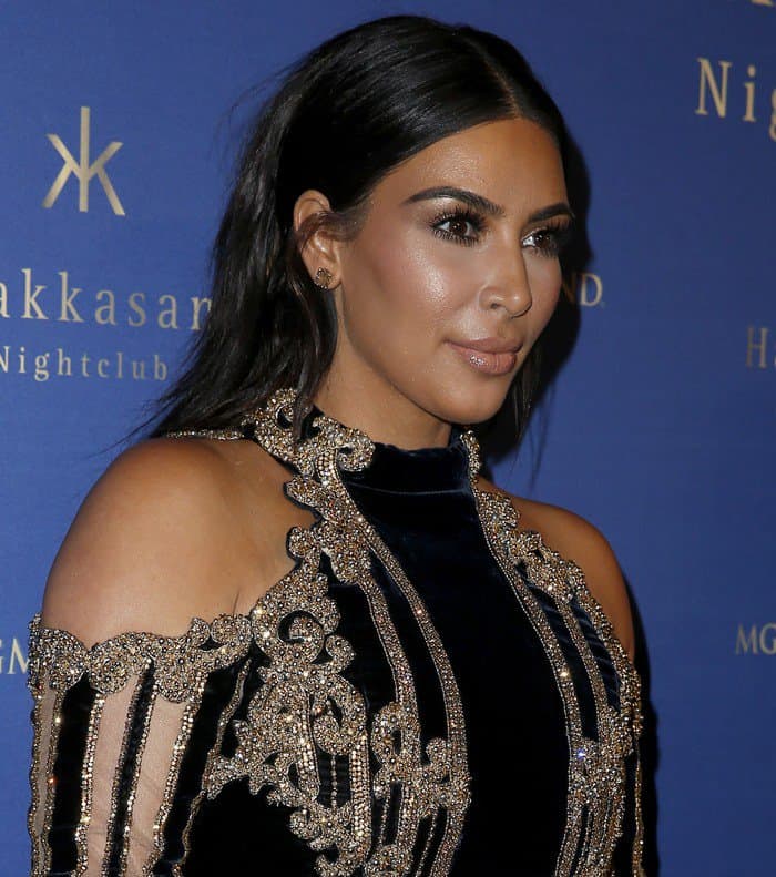 Kim Kardashian's sleek hairstyle and glowing makeup aimed for elegance