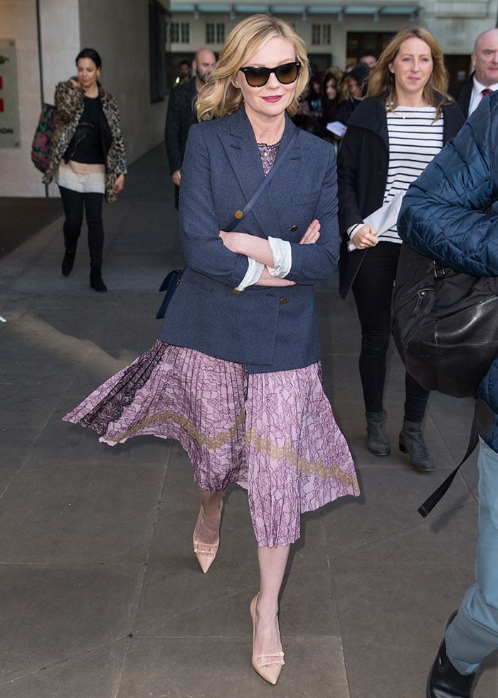 Kirsten Dunst hides her eyes behind a pair of sunglasses as she arrives at the BBC Radio 1 Studios in London