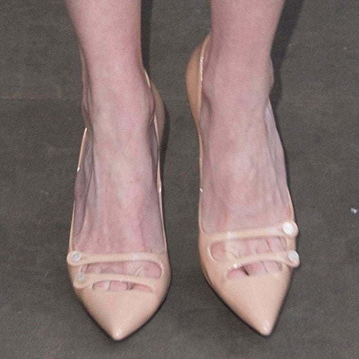 Kirsten Dunst's feet in patent leather Gucci pumps