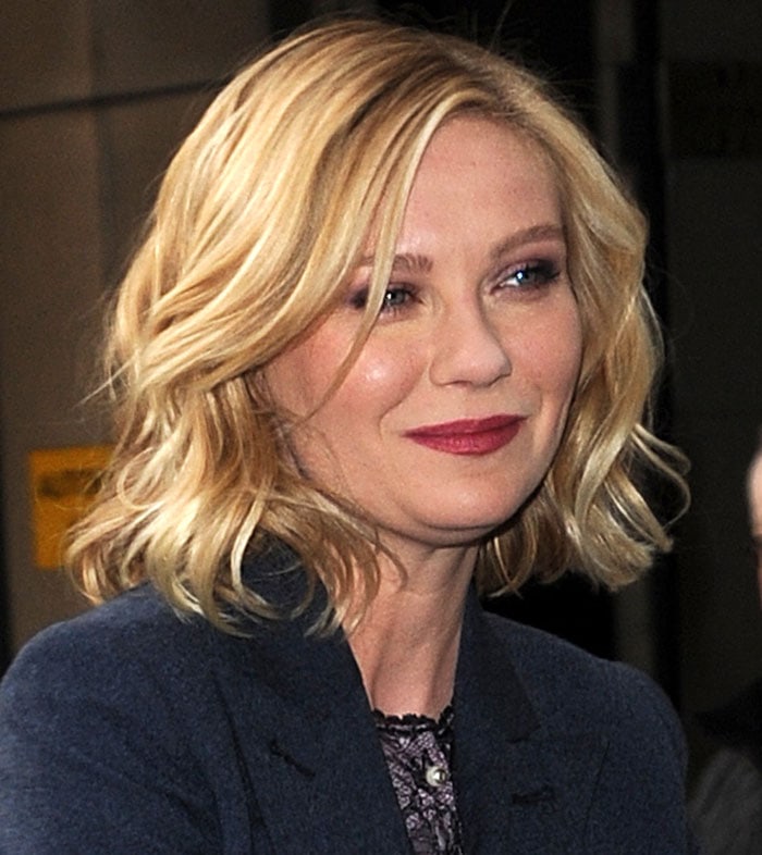 Kirsten Dunst wears her blonde hair down as she stands outside the BBC Radio 1 Studios