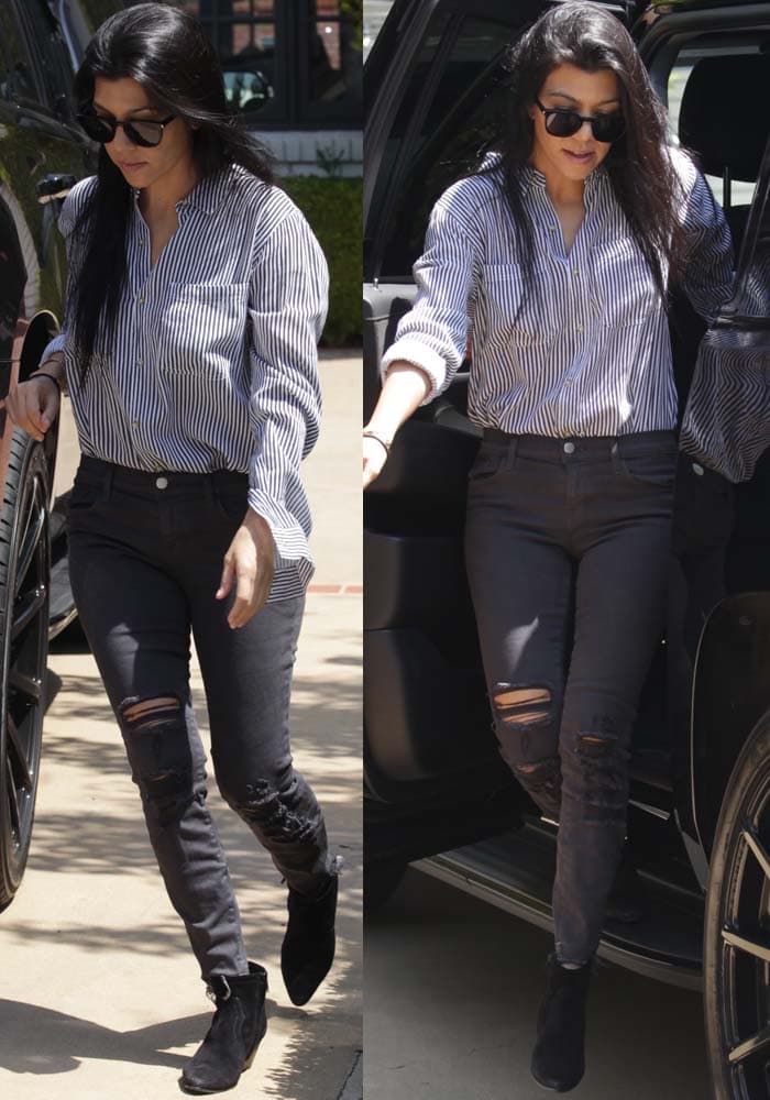 Kourtney Kardashian wearing Saint Laurent SL 93 sunglasses, J Brand 9326 low-rise cropped skinny jeans in Demented Grey, and Saint Laurent Rock zip ankle boots
