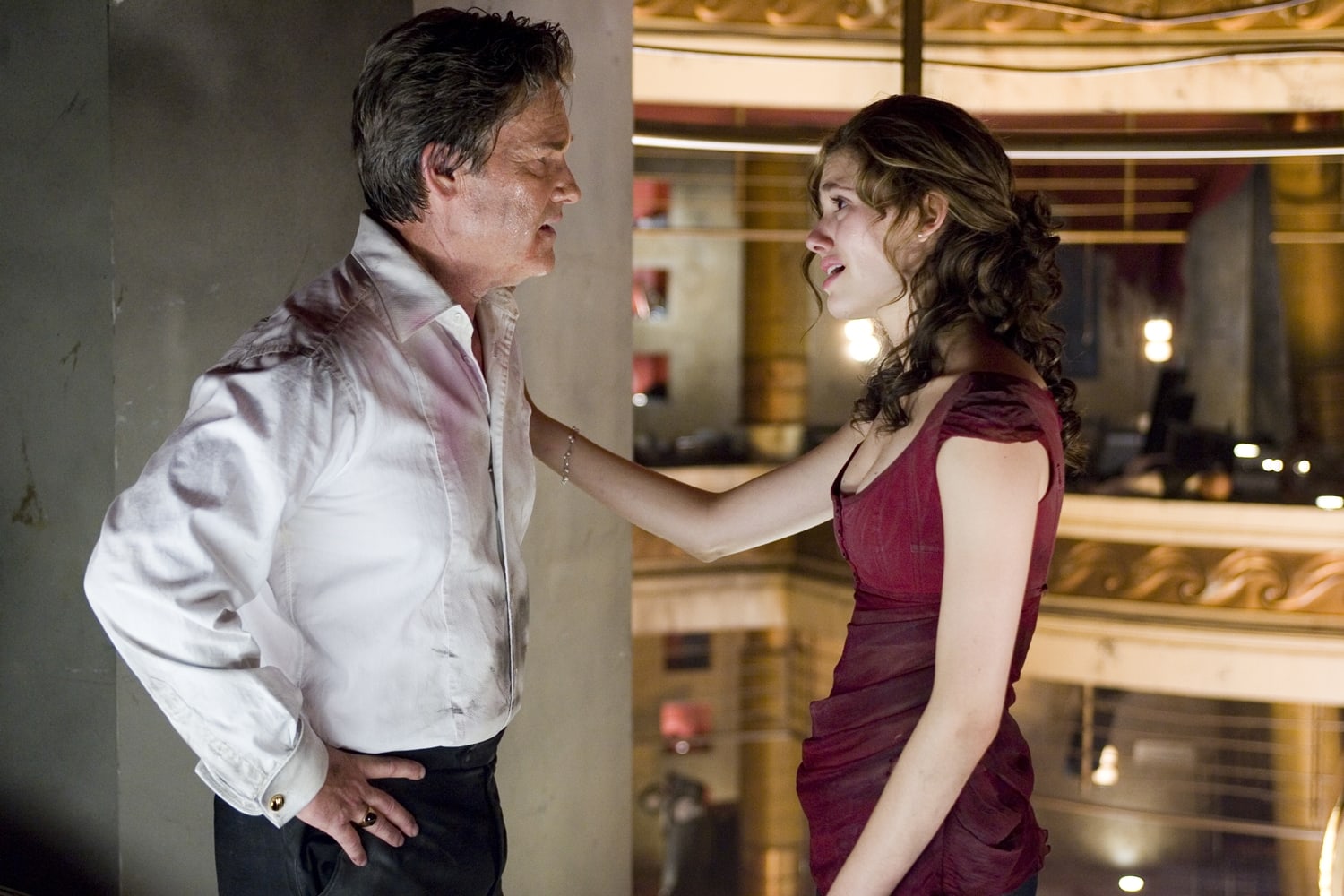 Kurt Russell as former New York City Mayor and firefighter Robert Ramsey and Emmy Rossum as his daughter Jennifer in Poseidon