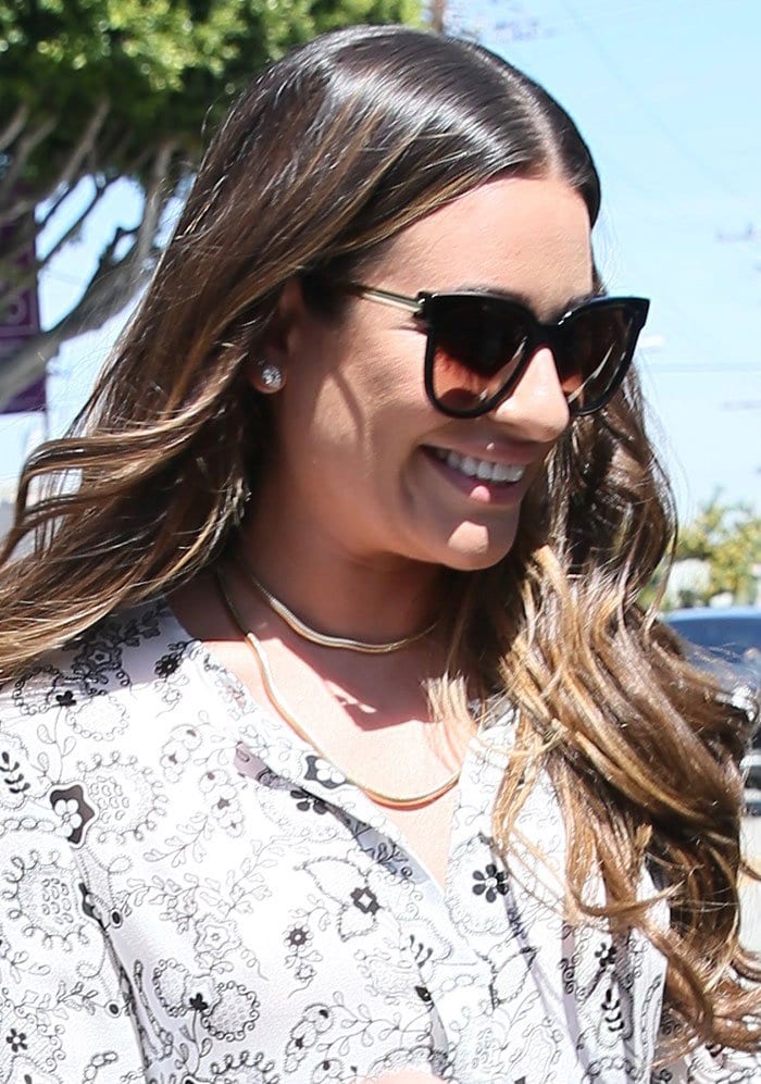 Lea Michele wears her hair down as she attends Glamour Magazine's Game Changers Lunch