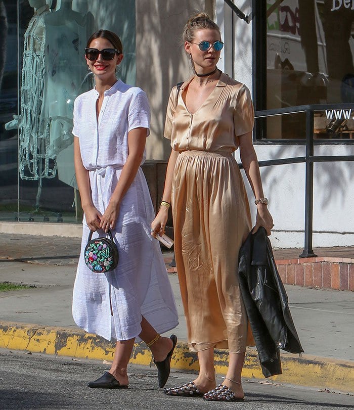 Lily Aldridge and Behati Prinsloo sport similar outfits and hairstyles as they shop together on Melrose Place