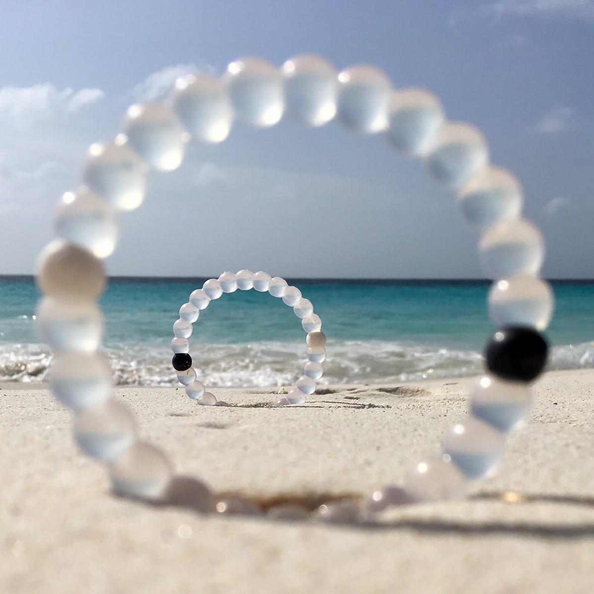 Lokai bracelets on a beach in Klein Curaçao, an uninhabited island in the Dutch Caribbean