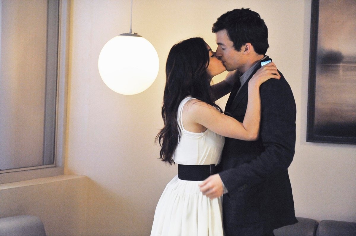 Lucy Hale as Aria Montgomery kissing Ian Harding as Ezra Fitz during an episode of Pretty Little Liars