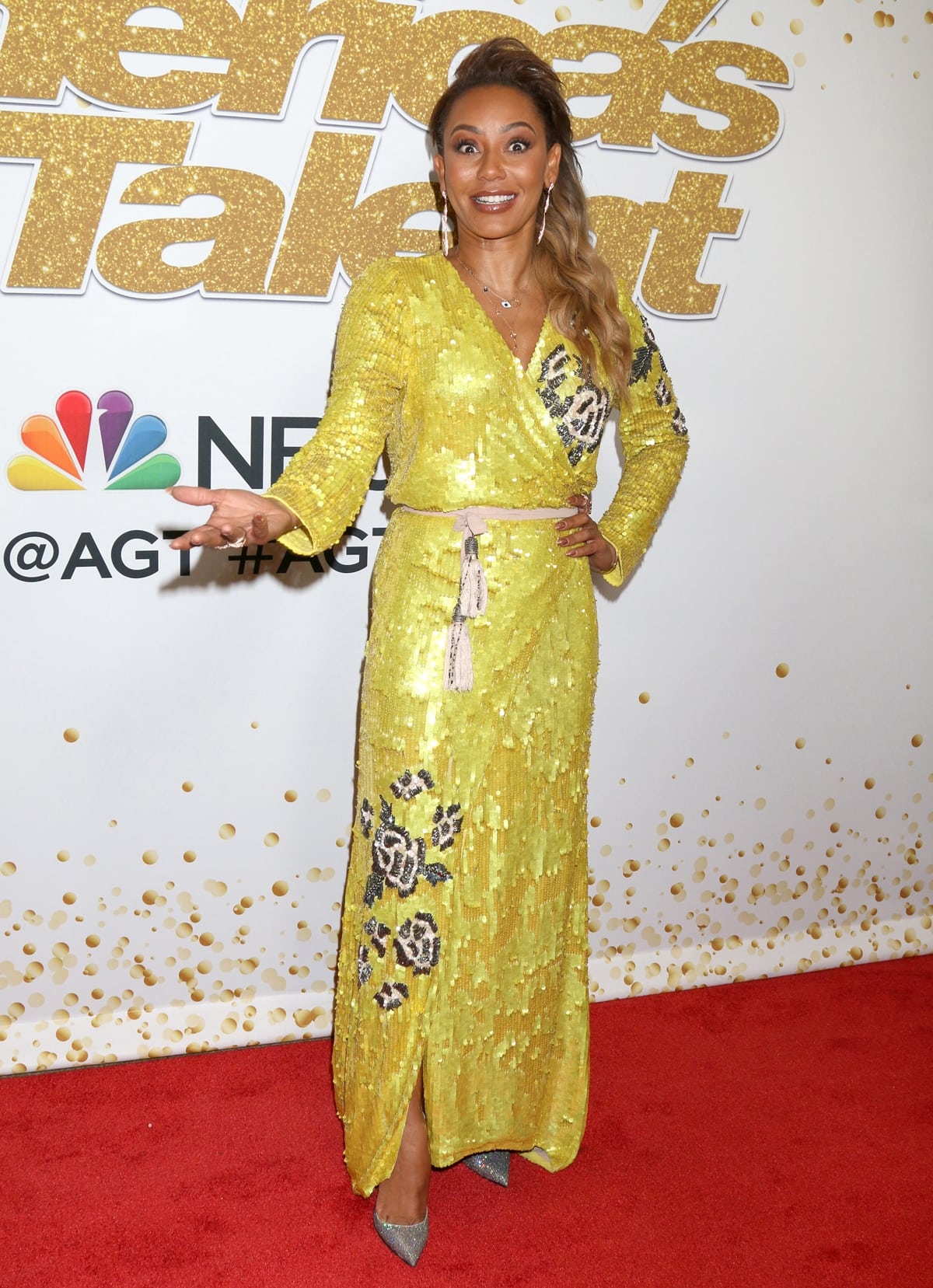 Mel B in a glittering gold wrap dress at the "America's Got Talent" Season 13 Live Show