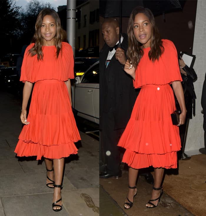 Naomie Harris opted for a vivid Kate Spade New York dress in a striking shade of orange, a hue that resonated strongly against the backdrop of the gathering