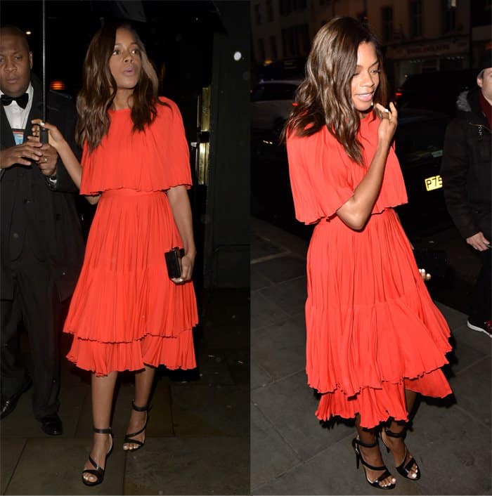Naomie Harris' attire featured cape-style sleeves that lent an air of sophistication and a hem adorned with delicate ruffles, imbuing the ensemble with a tasteful vintage charm reminiscent of the '70s era