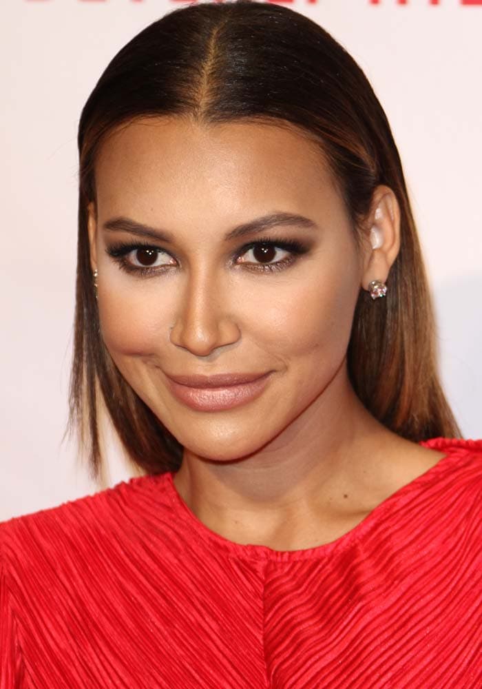 Naya Rivera center parts her hair at the 23rd Annual Race To Erase MS Gala at The Beverly Hilton Hotel