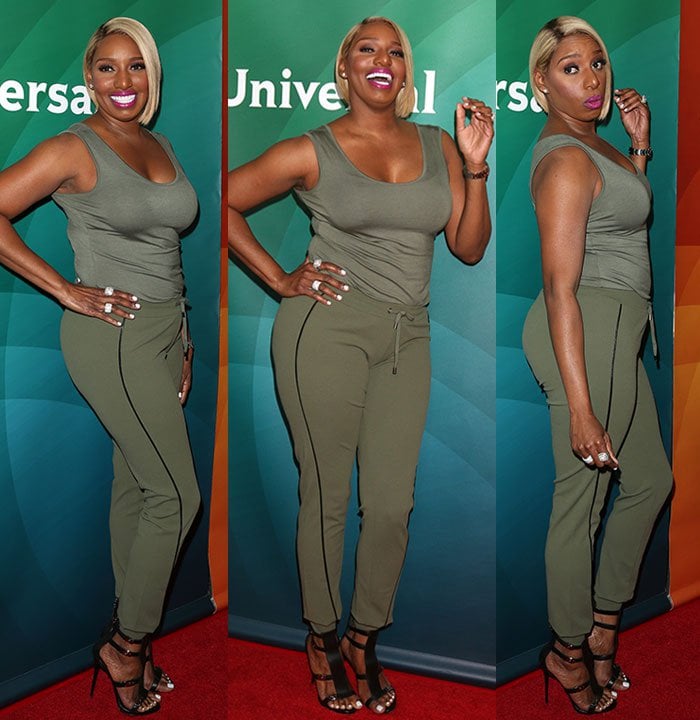 NeNe Leakes radiates confidence and charm, striking playful poses and showing off her chic, sporty outfit with flair on the red carpet
