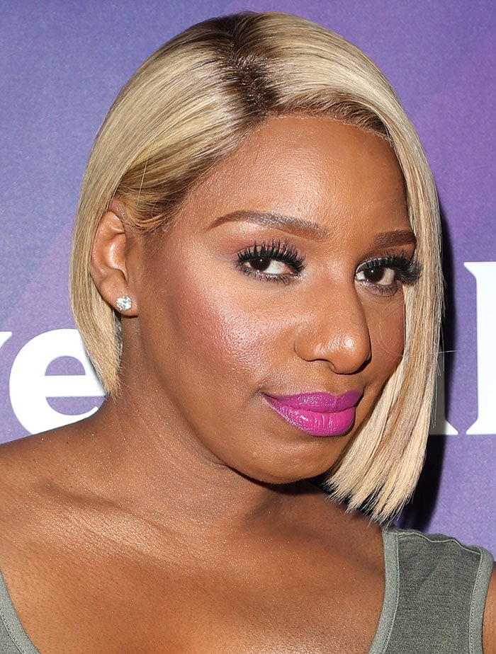 NeNe Leakes showcases a sleek, asymmetrical blonde bob hairstyle that perfectly frames her face