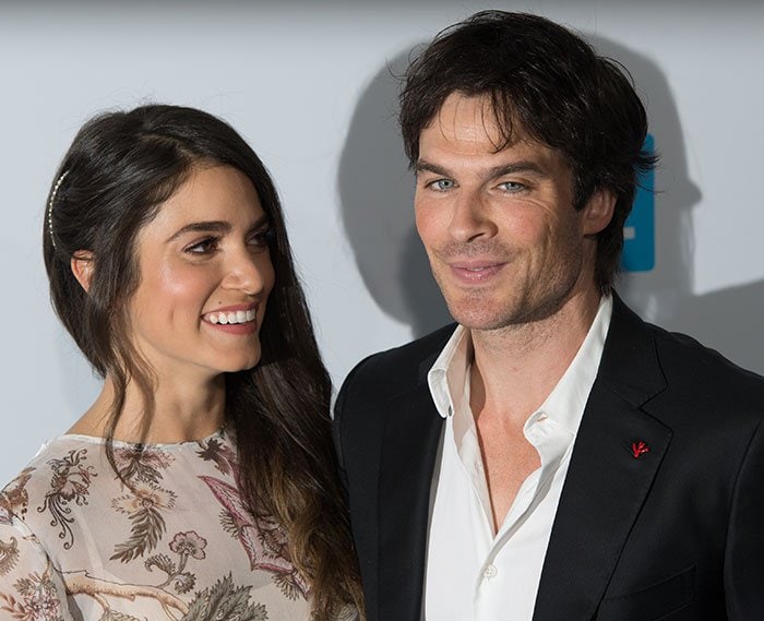 Nikki Reed and Ian Somerhalder share affectionate looks on the blue carpet of WE Day California