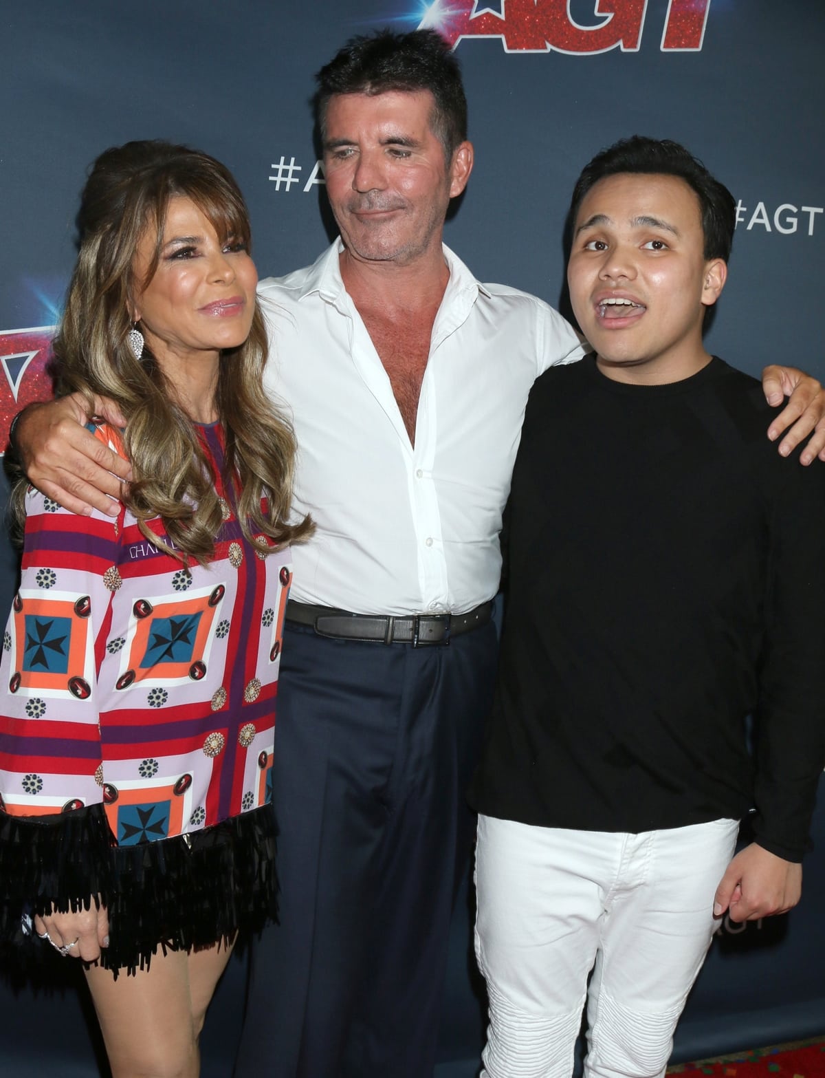 Paula Abdul and Simon Cowell posing with Kodi Lee, a legally blind Korean-American singer-songwriter and pianist who won the 14th season of the reality competition show America's Got Talent