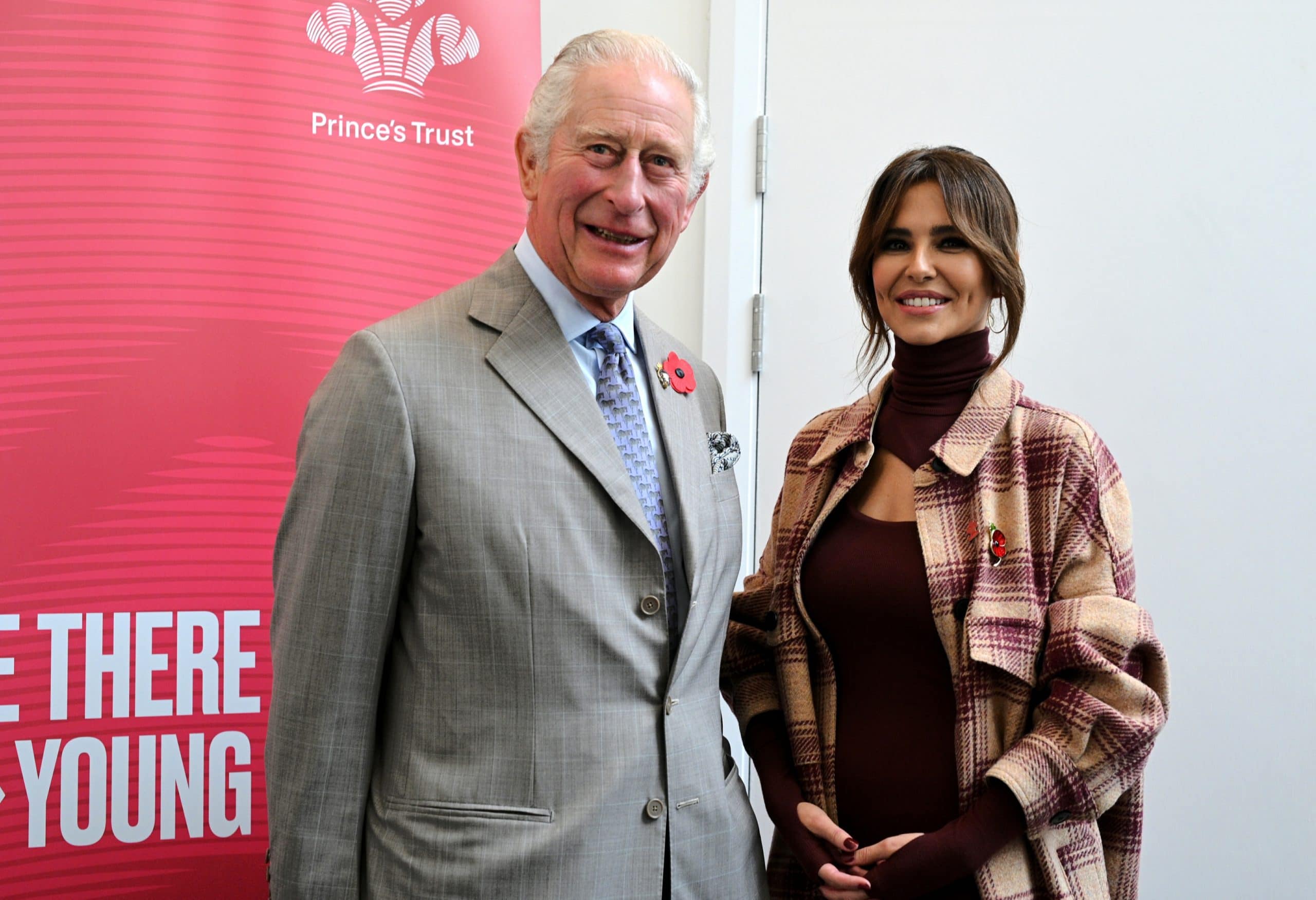 Prince Charles, Prince of Wales, and Cheryl Tweedy pose for a photograph with the graduates of the team program