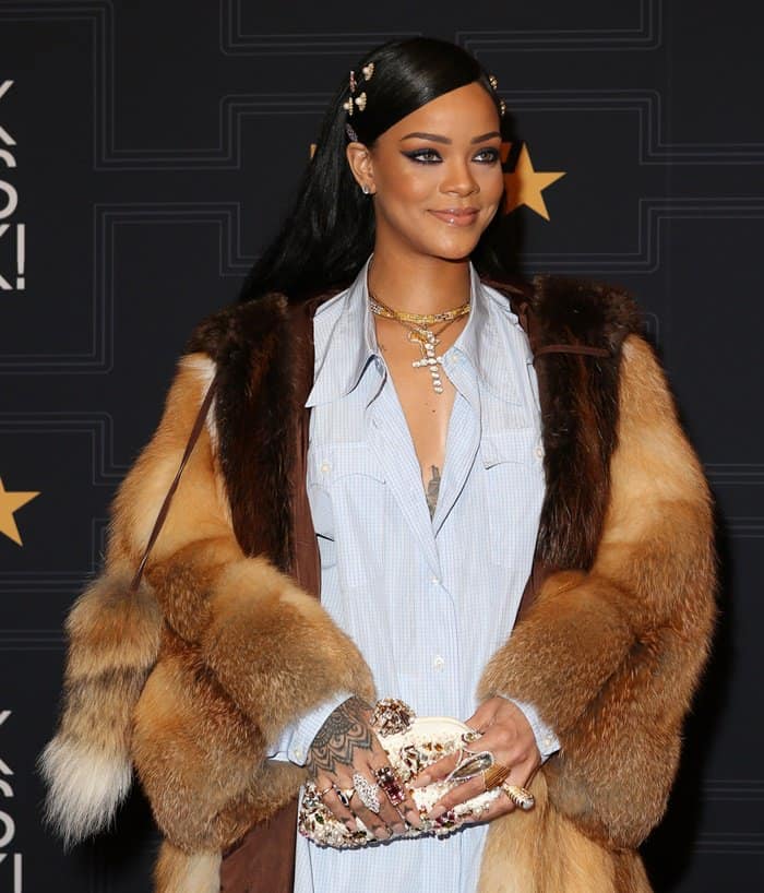 Rihanna styled her fur coat with a button-down shirt and shorts from the Miu Miu Fall 2016 Collection