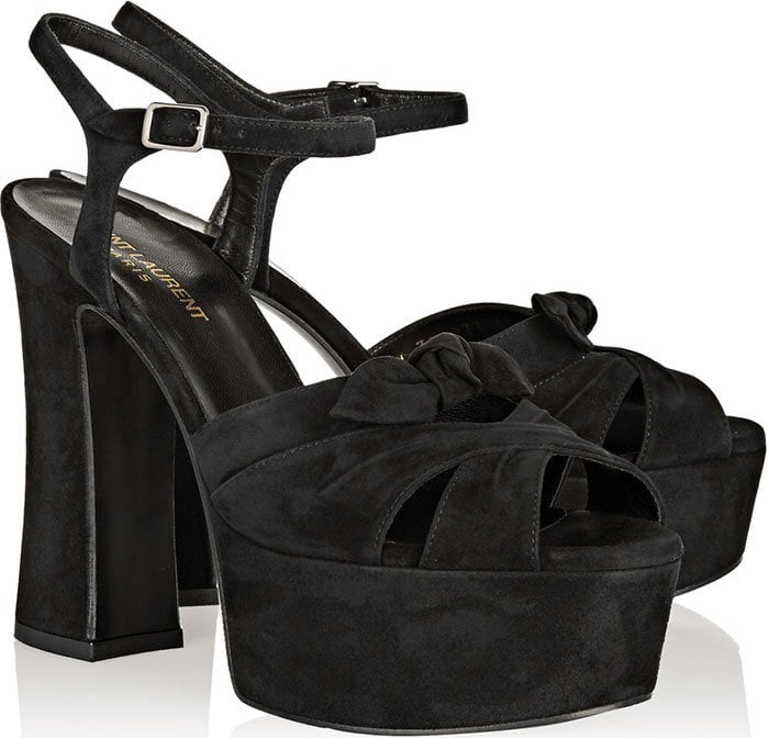 Crafted from plush black suede, they have a knotted front and a sizeable platform to balance the towering heel