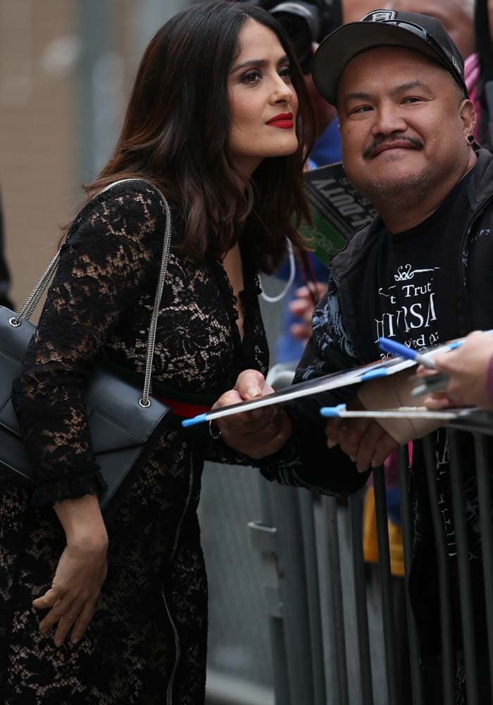 Salma Hayek poses for photos with fans despite her lack of sleep