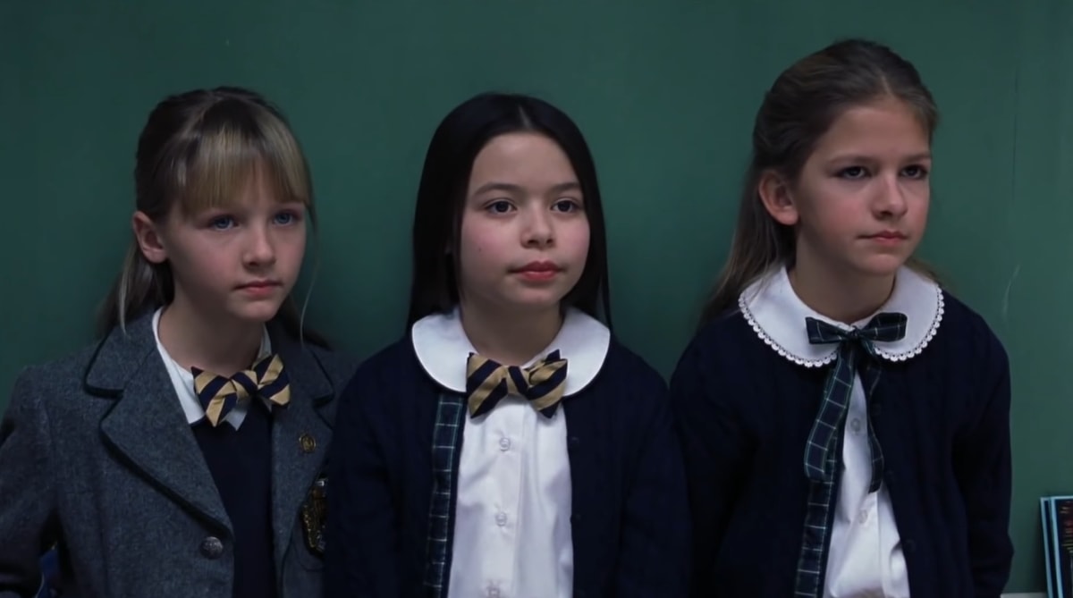 Jordan-Claire Green as Michelle (groupie), Miranda Cosgrove as Summer "Tinkerbell" Hathaway (band manager), and Veronica Afflerbach as Eleni (groupie) in the 2003 comedy film School of Rock