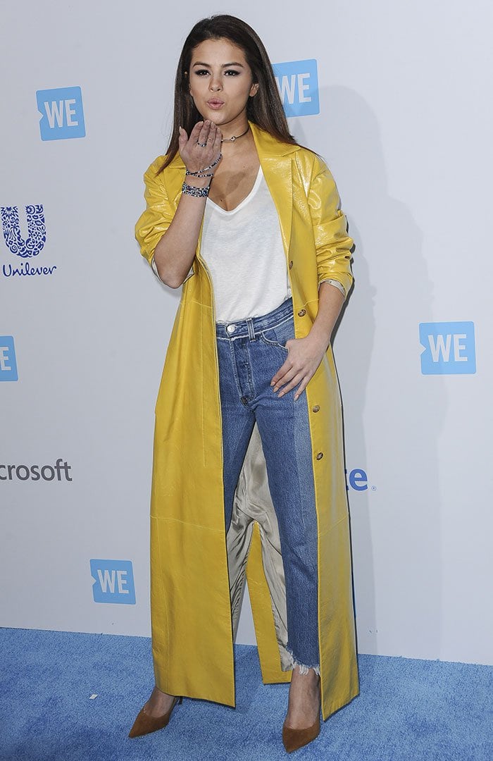 Selena Gomez blows a kiss from the blue carpet of WE Day California