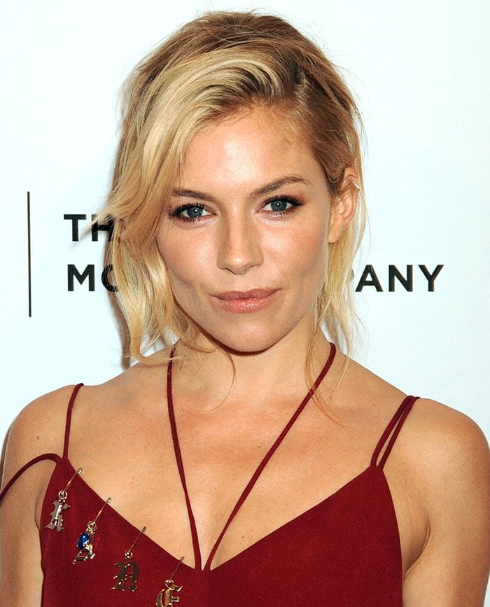 Sienna Miller ties her hair back for the premiere of "High-Rise"