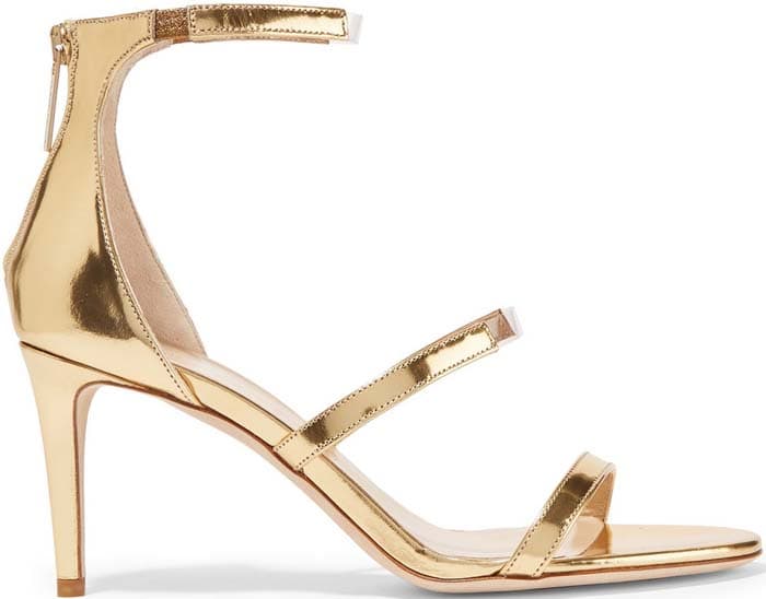 Tamara Mellon's 'Horizon' sandals are crafted from light-catching gold leather set on a thin heel with clear PVC trims and an elasticated ankle strap for the perfect fit