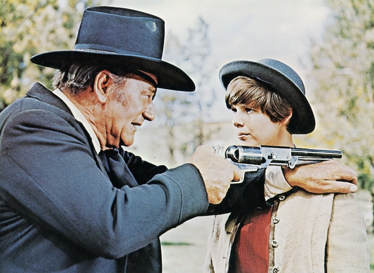 John Wayne stars as Reuben J. "Rooster" Cogburn and Kim Darby portrays Mattie Ross in the 1969 American Western film "True Grit"