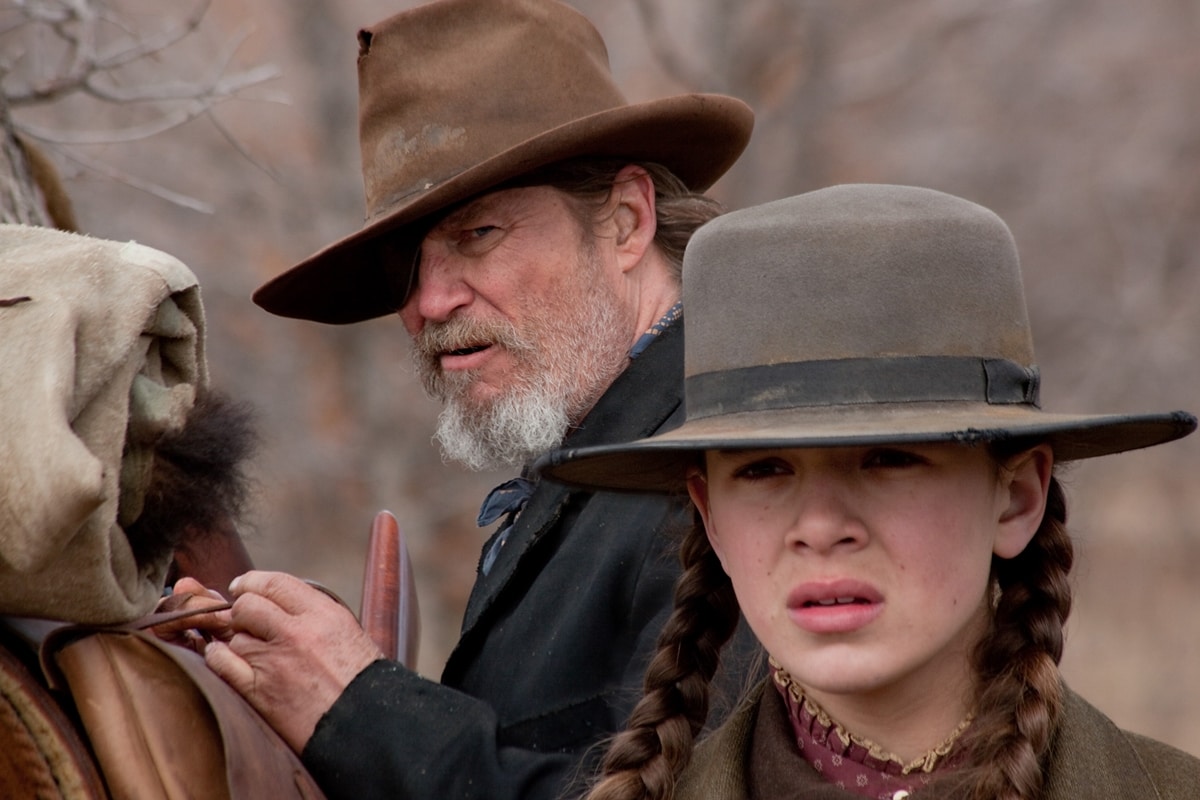 Jeff Bridges portrays Deputy U.S. Marshal Rooster Cogburn and Hailee Steinfeld portrays Mattie Ross in the 2010 American Western film "True Grit"