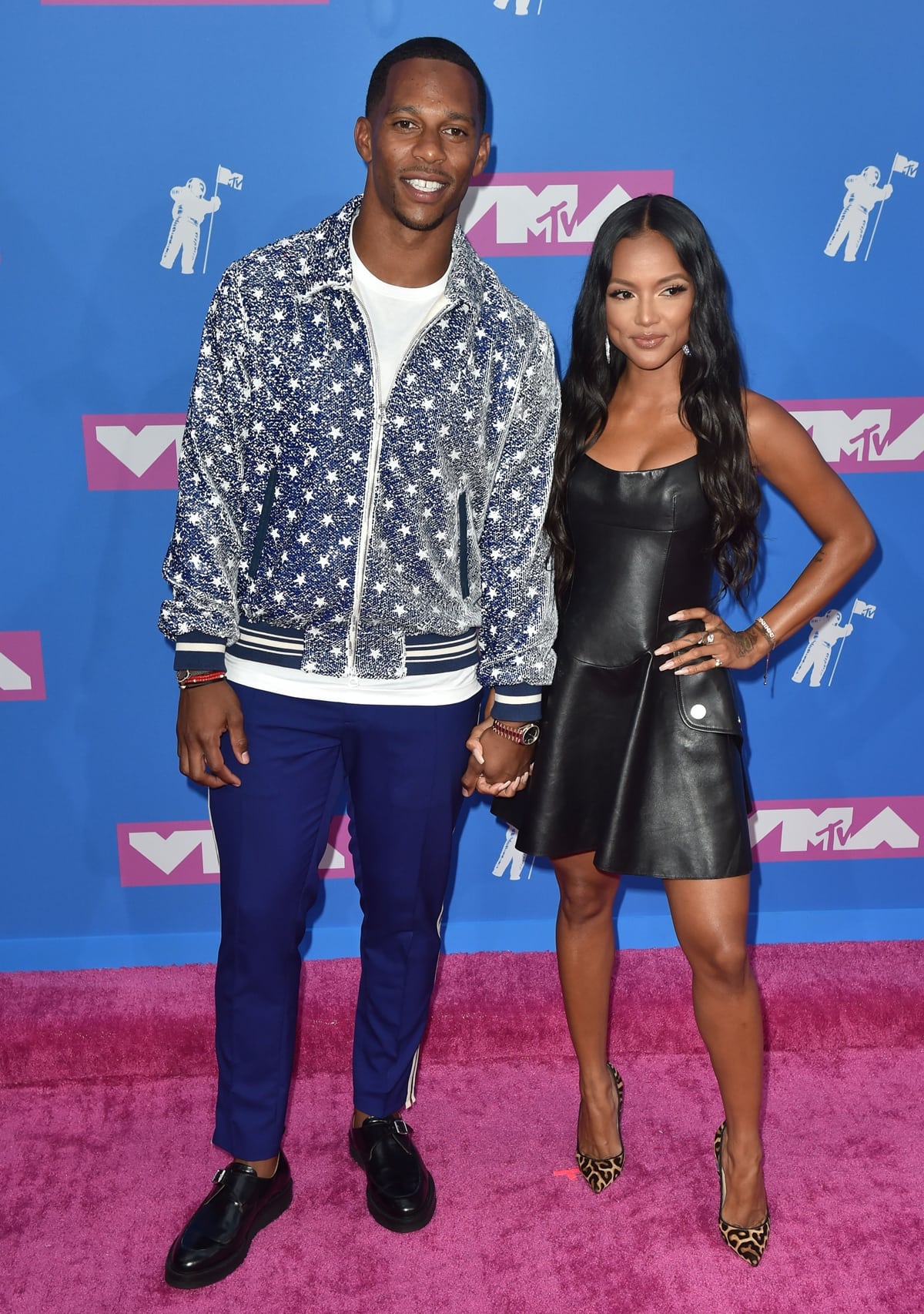 A tall Victor Cruz poses with his much shorter girlfriend Karrueche Tran at the 2018 MTV Video Music Awards