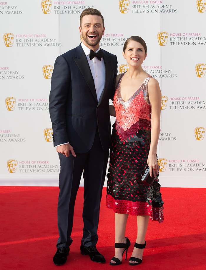 Anna Kendrick wears an Altuzarra dress while posing on the red carpet with Justin Timberlake