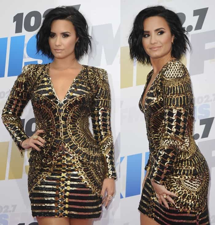 Demi Lovato dazzles in a black and gold Balmain sequin dress, showcasing its intricate design and bold patterns